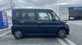 Passenger side view of black Daihatsu Tanto