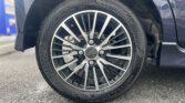10-spoke alloy rim on Daihatsu Tanto with clean tire tread