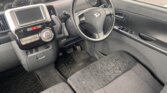 Driver-side floor pedals and front seat of Daihatsu Tanto
